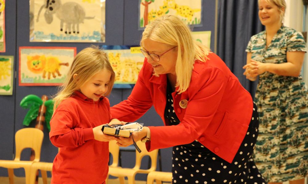 Nursery student with a member of staff at Town Close.